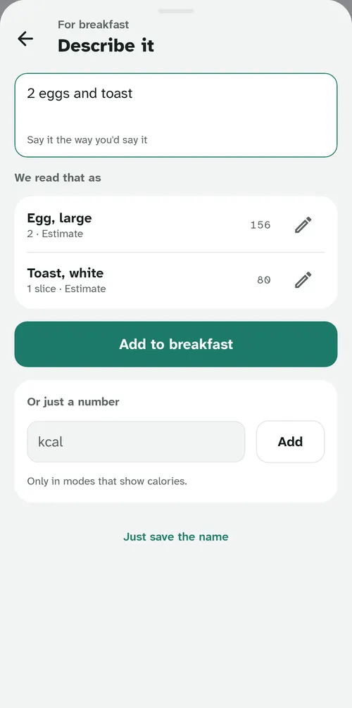 Describe it: 2 eggs and toast typed in, read as two large eggs and a slice of white toast.